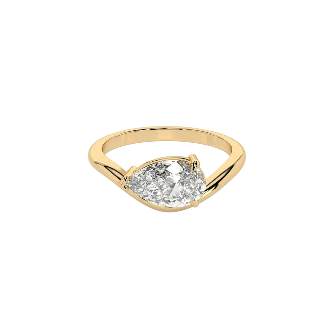 An 18k yellow gold engagement ring with a pear cut stone centerpiece, set with three claws on a wave band.