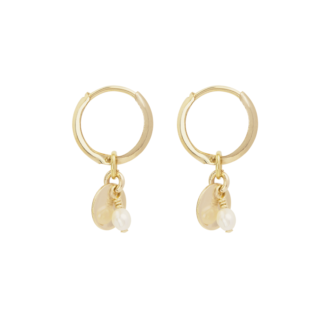 A pair of gold-filled mini hoop earrings with a flat disc and small freshwater pearl dangling below.